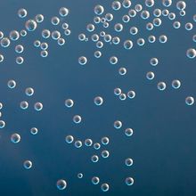 Equally-sized droplets of a nucleic acid sample.