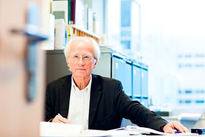 Lasker Award winner Piet Borst sits at his desk.